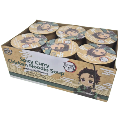 A bulk cardboard display box of Demon Slayer Spicy Curry Chicken Noodle Soup, showing multiple individual round bowls with character-themed lids inside.