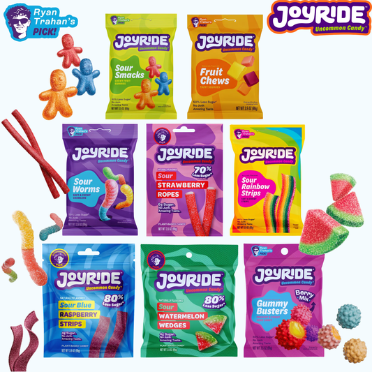 Promotional image featuring Joyride Uncommon Candy assorted 3.5 oz peg bags, including Sour Smacks, Fruit Chews, Sour Worms, Sour Strawberry Ropes, Sour Rainbow Strips, Sour Blue Raspberry Strips, Sour Watermelon Wedges, and Gummy Busters Berry Mix. Colorful gummy candies and the Joyride logo surround the product lineup on a white background.