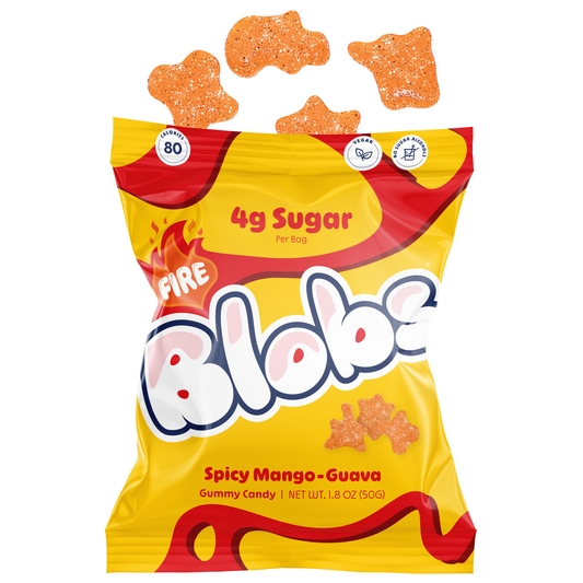 A bag of Blobs Spicy Mango-Guava gummy candy with several orange gummy candies floating above the open top of the bag, on a plain white background.